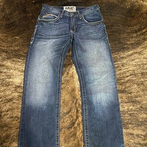 Men’s Ariat M4 Low Rose Boot Cut medium wash jean. 30x34.